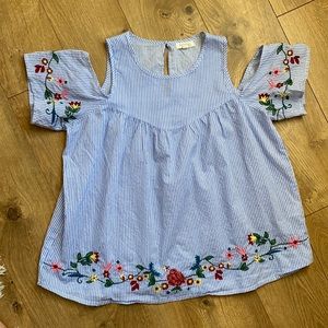 Beautiful blouse with floral embroidery detail